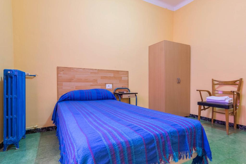 Posteľ alebo postele v izbe v ubytovaní Hostal Urgell