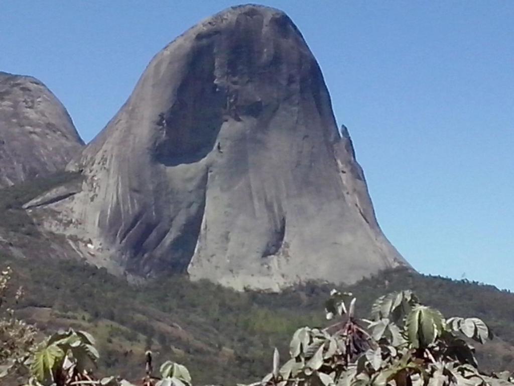 a rock formation on the side of a mountain at Pedra Azul - Flat Particular in Pedra Azul