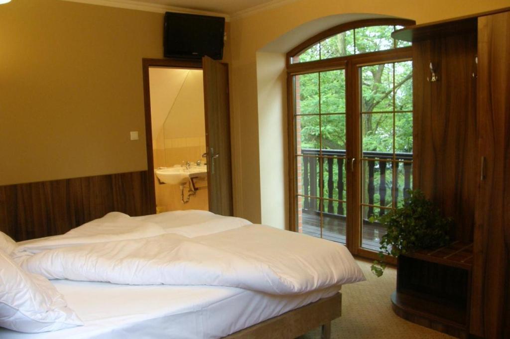 Posteľ alebo postele v izbe v ubytovaní Hotel Belfer