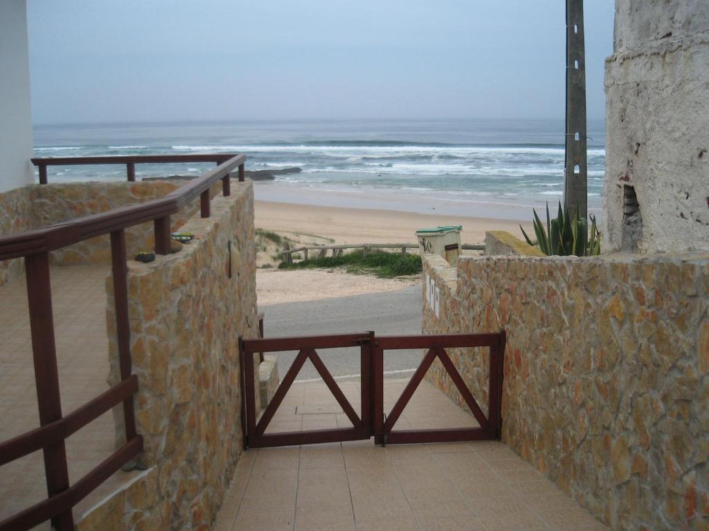 a stairway to the beach with the ocean in the background at Lucas House 2 - Seabreeze apartment in Aljezur