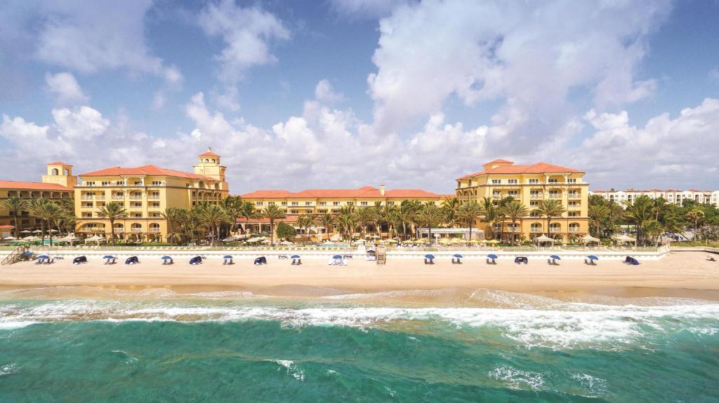 a view of the beach at a resort at Eau Palm Beach Resort & Spa in Palm Beach