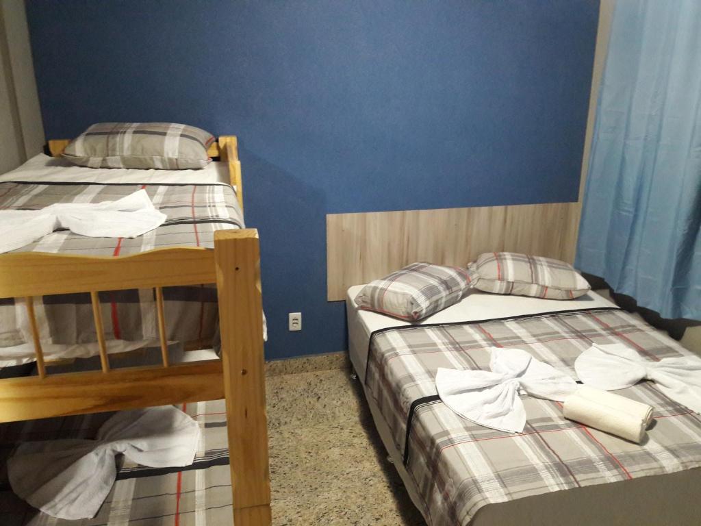 Postel nebo postele na pokoji v ubytování Hostel Falcão-Suites Privativas com Ar Condicionado