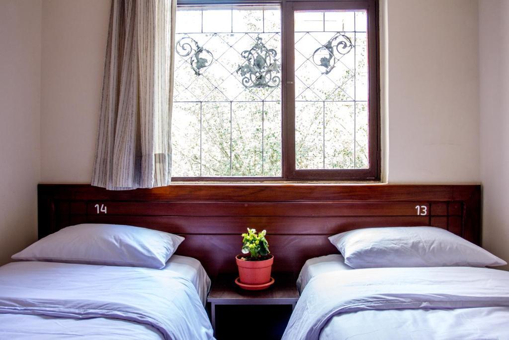 Postel nebo postele na pokoji v ubytování El Patio Hostel Quito