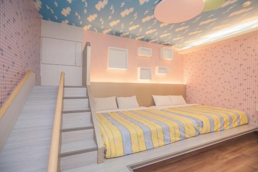 Postel nebo postele na pokoji v ubytování Cherry Blossom Motel
