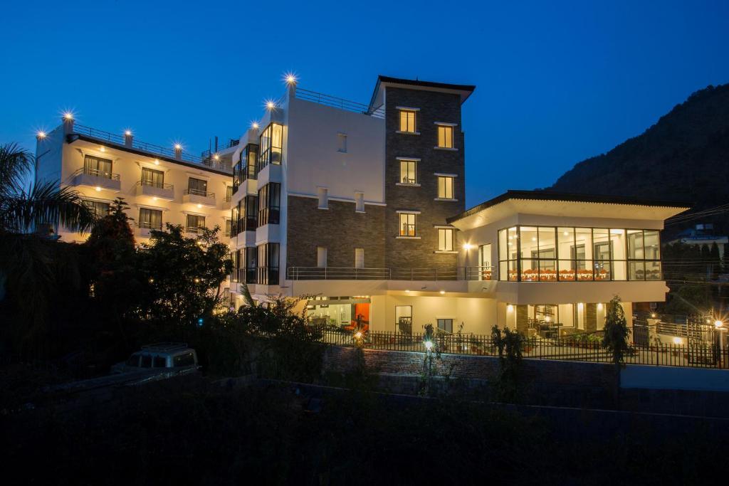 a large building at night with lights at Tuki Resort in Pokhara