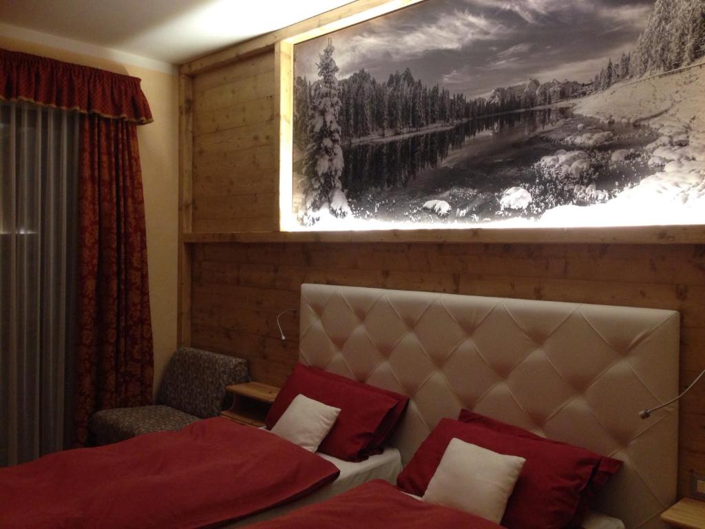 Postel nebo postele na pokoji v ubytování Hotel Lavaredo