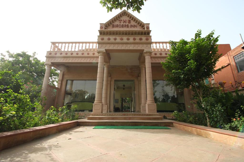 an entrance to a building with a porch at The Birder's Inn in Bharatpur