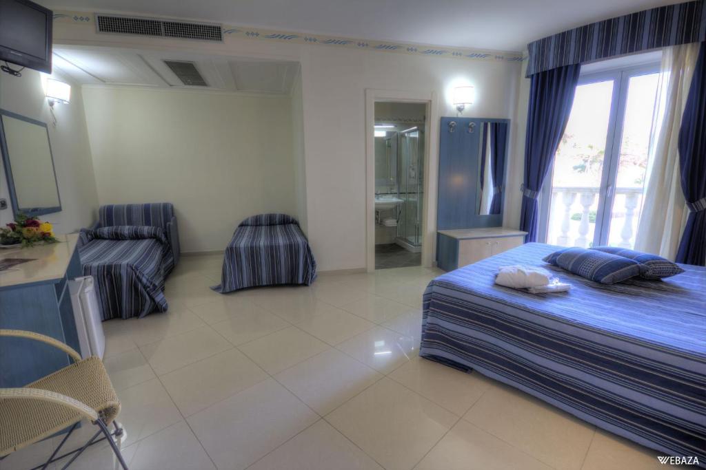 Postel nebo postele na pokoji v ubytování Grand Hotel Dei Cavalieri