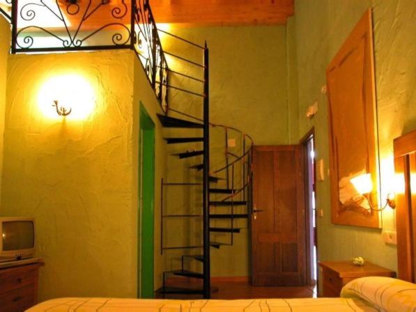 Postel nebo postele na pokoji v ubytování La Casona de Navaleno