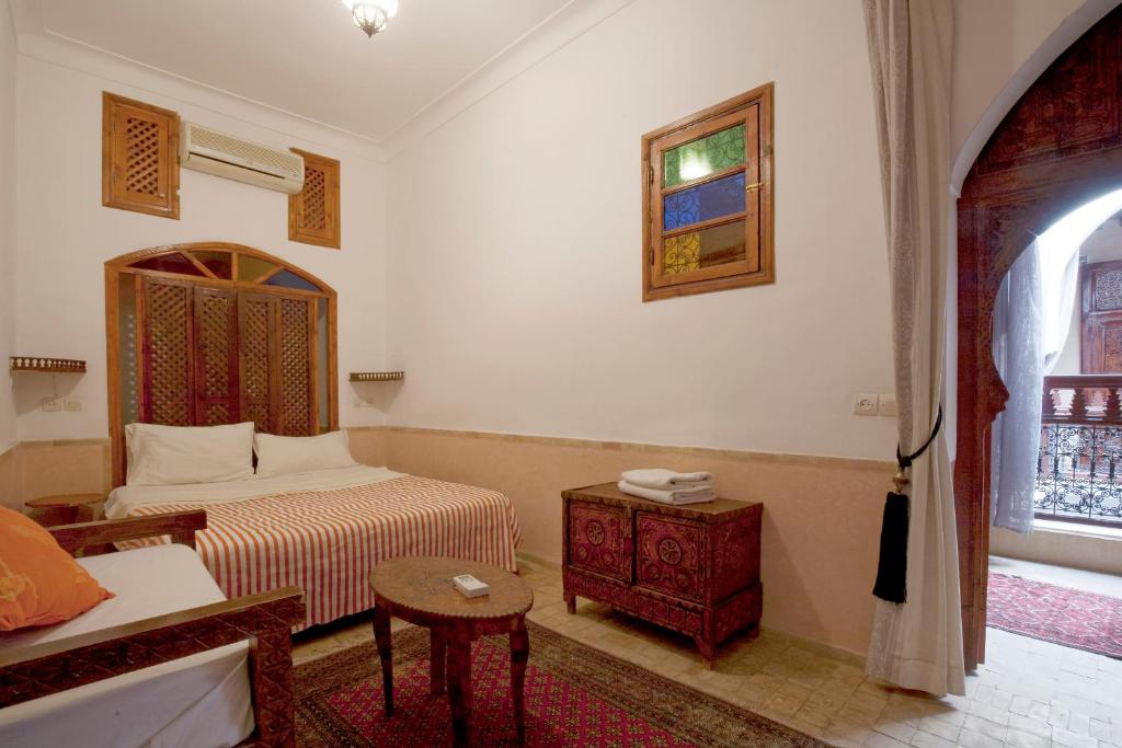 Postel nebo postele na pokoji v ubytování Riad Wardate Rita