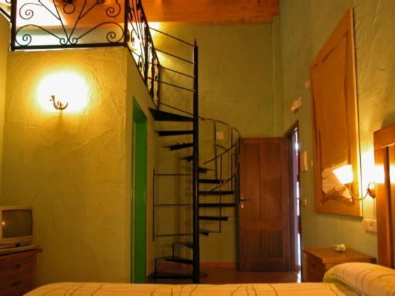 Postel nebo postele na pokoji v ubytování La Casona de Navaleno