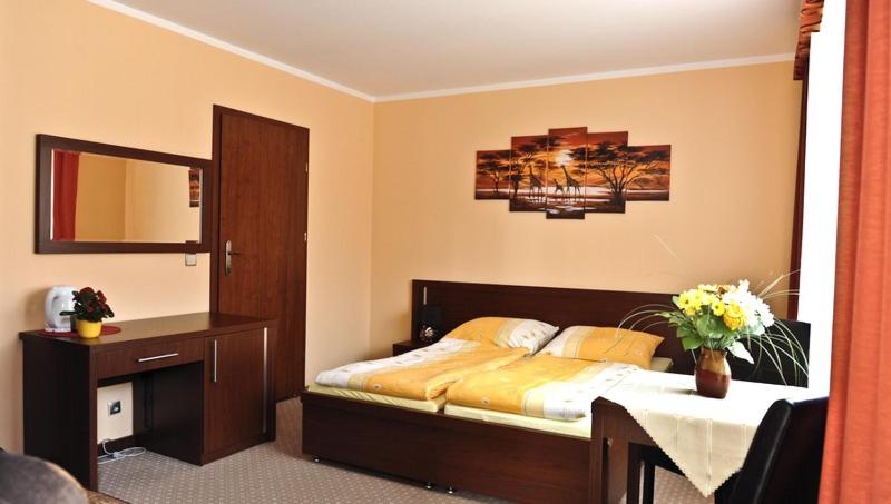Postel nebo postele na pokoji v ubytování Villa Carmen