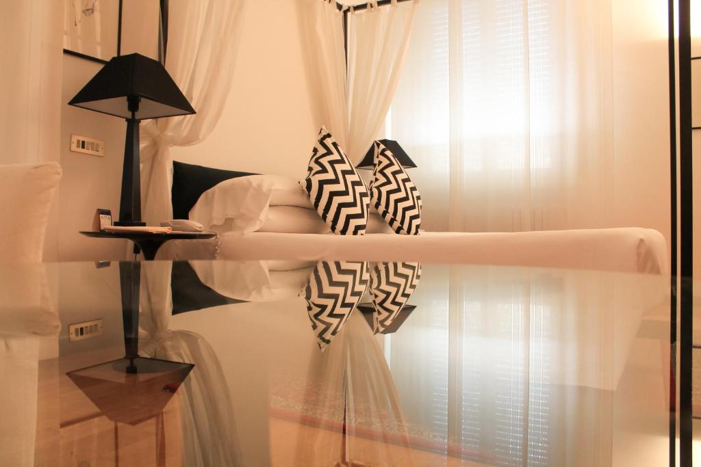 Postel nebo postele na pokoji v ubytování Grand Hotel Passetto