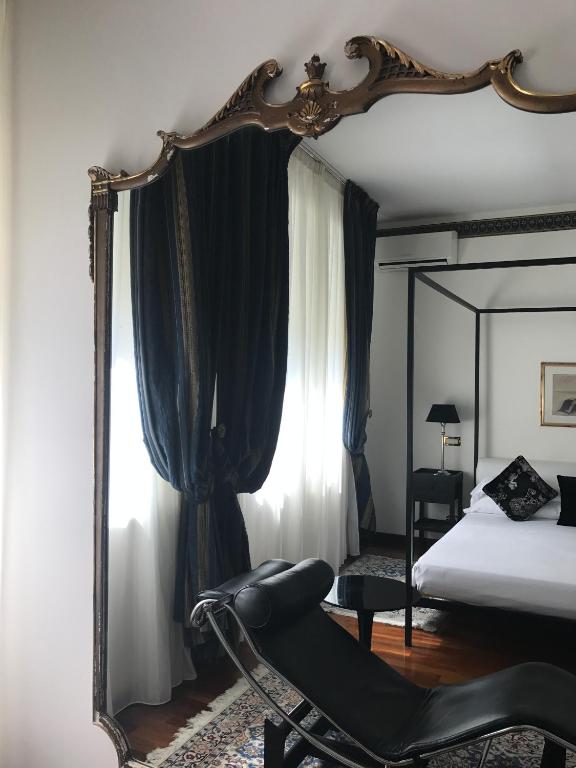 Postel nebo postele na pokoji v ubytování Grand Hotel Passetto
