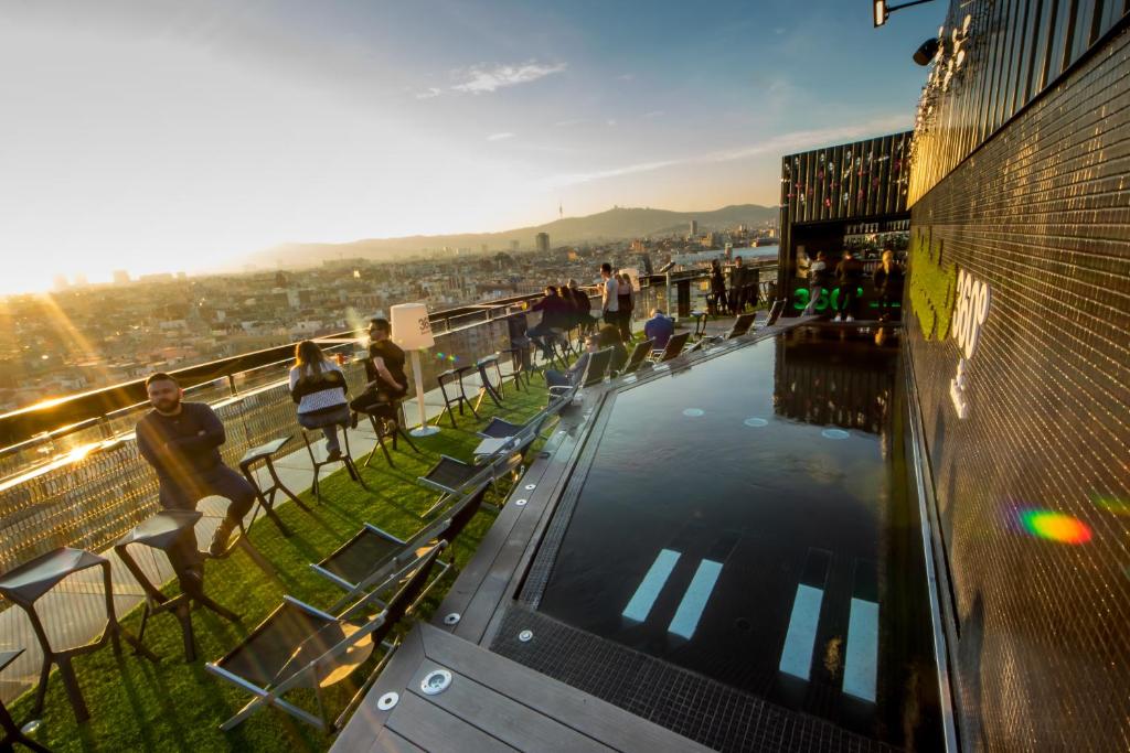 a crowd of people standing on top of a pier at Barceló Raval in Barcelona