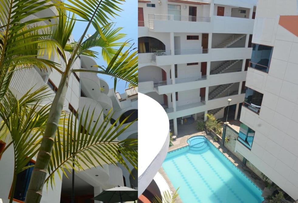 un edificio con una piscina junto a una palmera en Hotel Remanso, en Chimbote