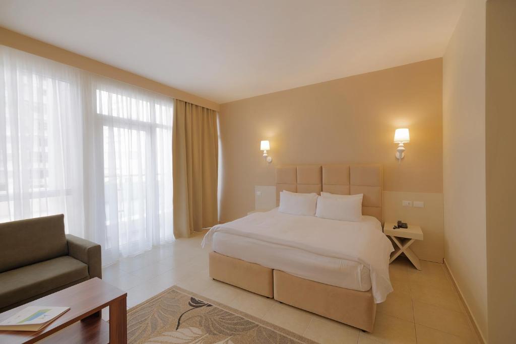 Postel nebo postele na pokoji v ubytování Horizont Hotel