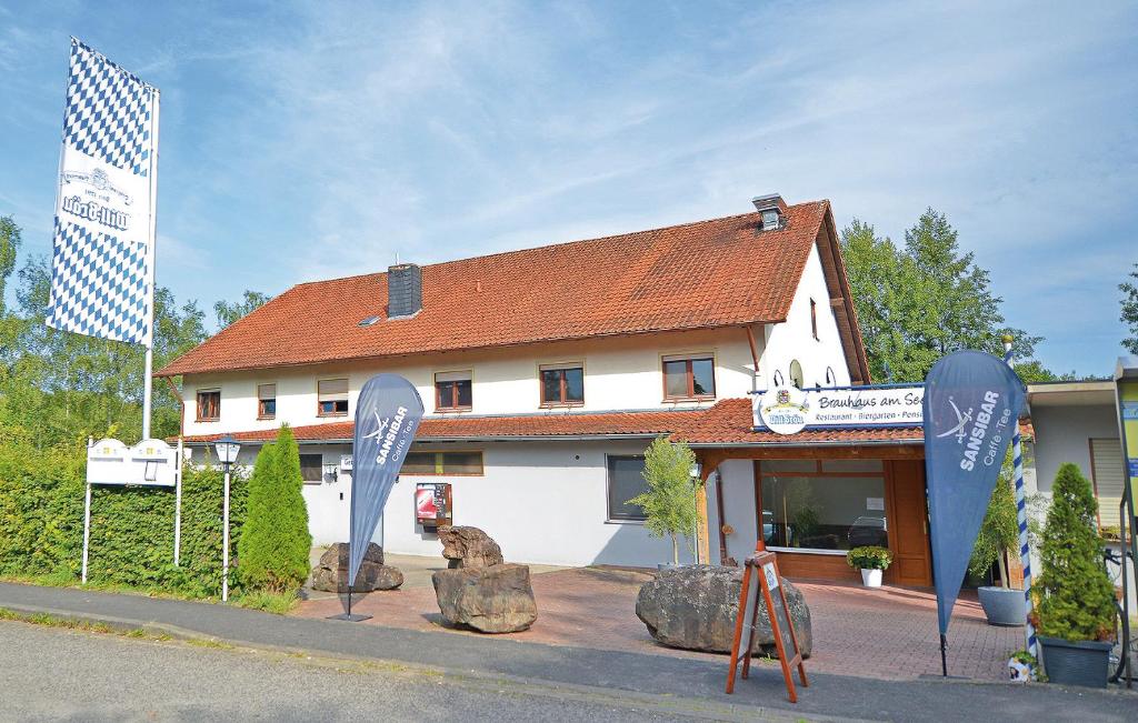 a building with signs in front of a building at Brauhaus am See in Oberthulba