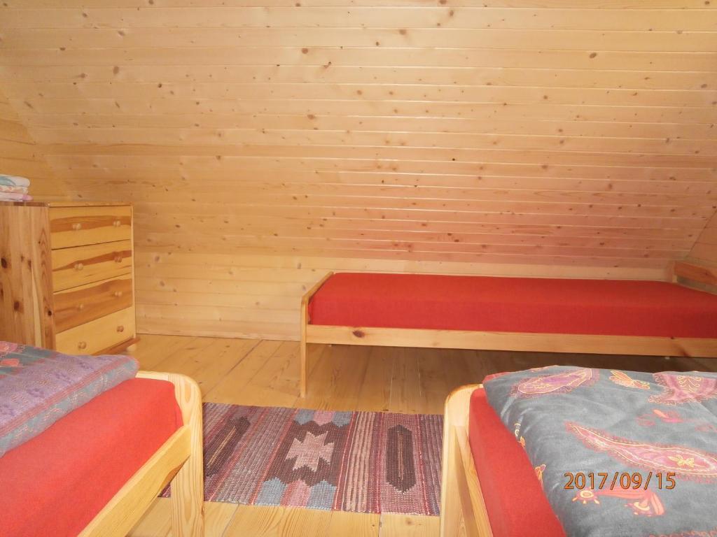 Posteľ alebo postele v izbe v ubytovaní Drevenica Silvia