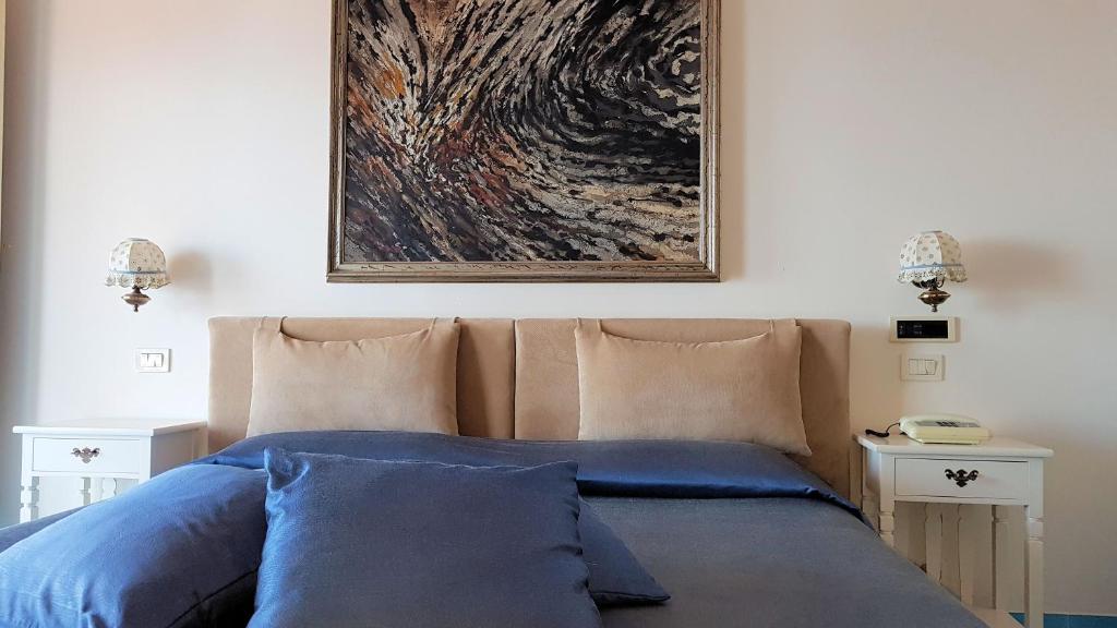Postel nebo postele na pokoji v ubytování Grand Hotel San Michele