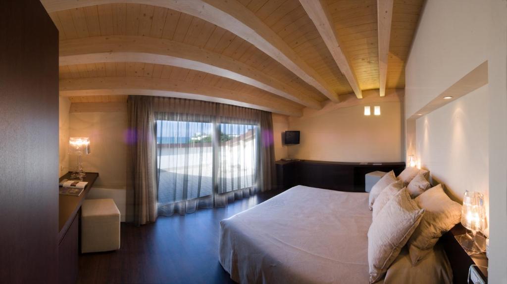 Postel nebo postele na pokoji v ubytování Hotel Europa Monetti