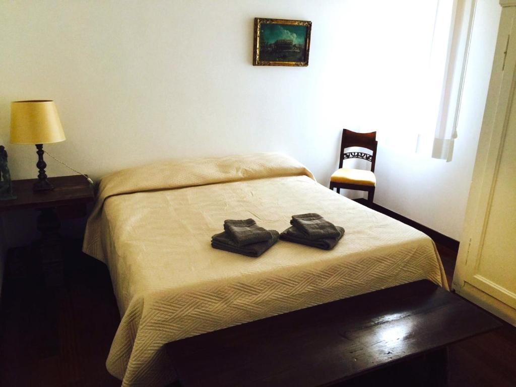Una cama o camas en una habitación de Ca'Lodovica