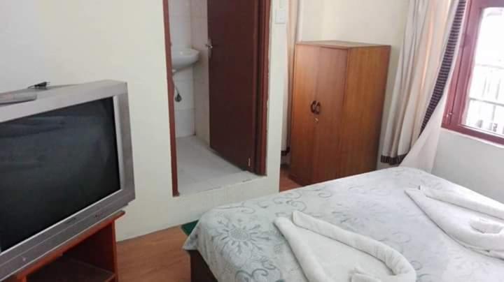 Postel nebo postele na pokoji v ubytování Hotel Sisters Home