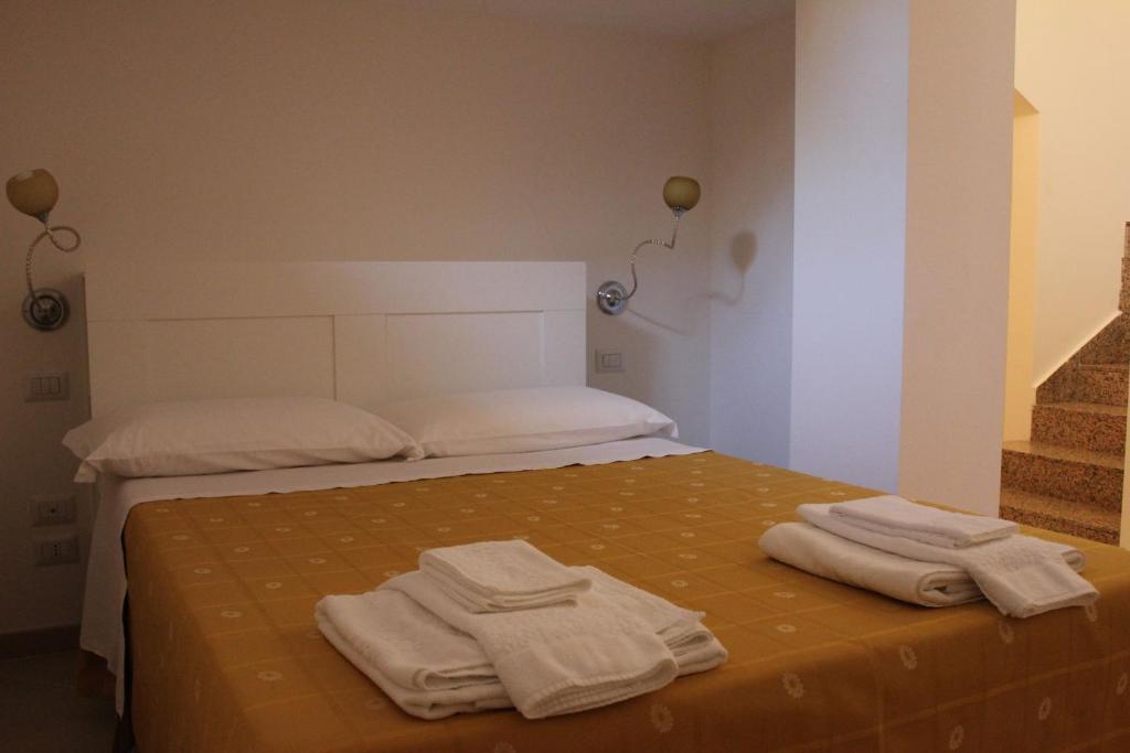 Postel nebo postele na pokoji v ubytování B&B Solacium