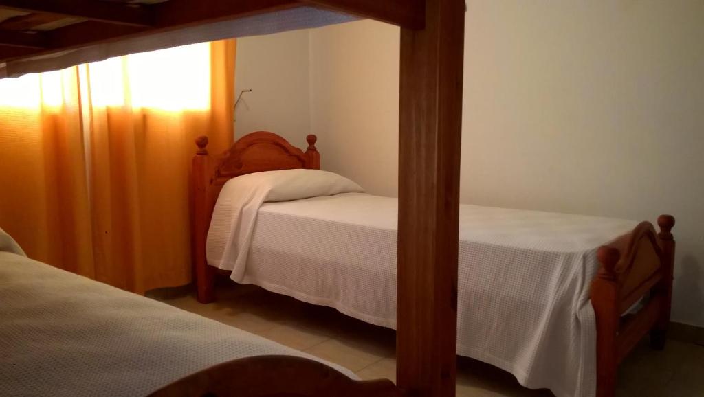 Postel nebo postele na pokoji v ubytování BAMBÚ Apart