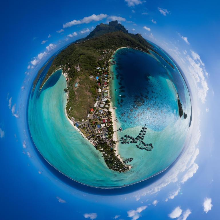 an aerial view of an island in the ocean at Village Temanuata in Bora Bora