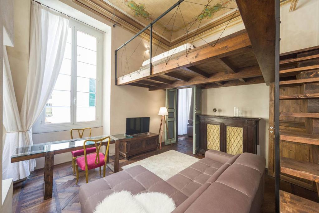 A bed or beds in a room at Charming Genova | Residenza d'epoca