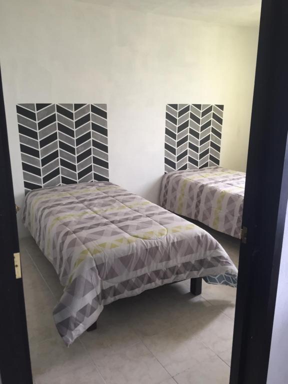 Letto o letti in una camera di Hotelito Ejido