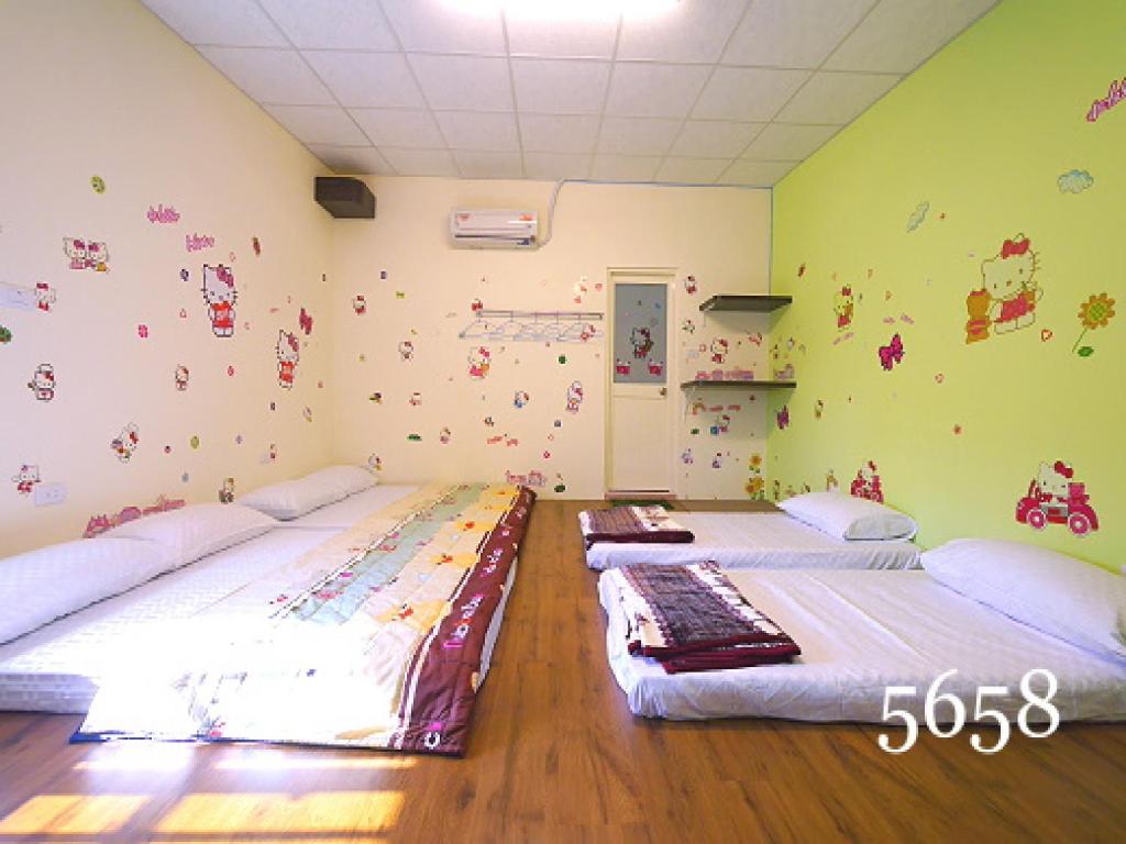 Postel nebo postele na pokoji v ubytování Hua Qiao De Jia