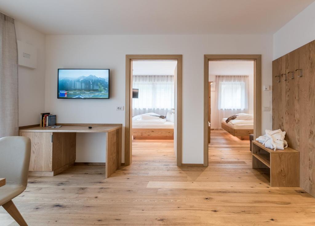 Postel nebo postele na pokoji v ubytování Hotel B&B Feldmessner