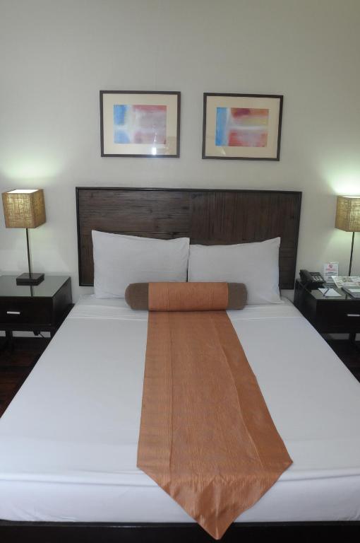 Postel nebo postele na pokoji v ubytování El Cielito Hotel - Baguio