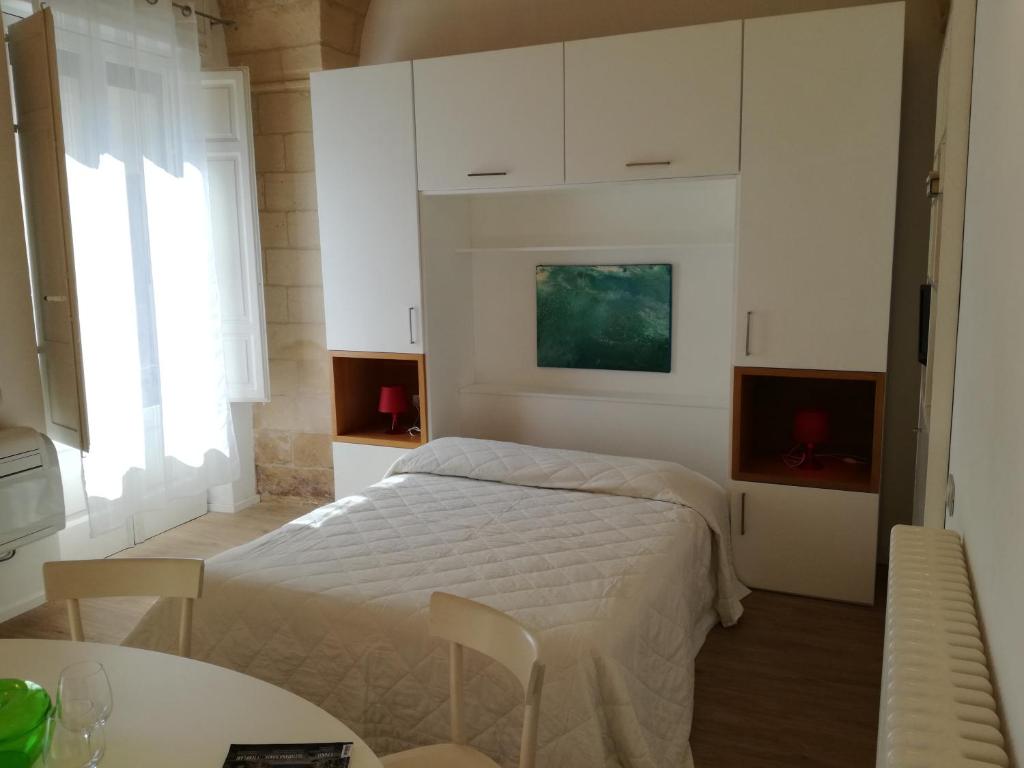 Posteľ alebo postele v izbe v ubytovaní GoodStay Al 14 (monolocale)