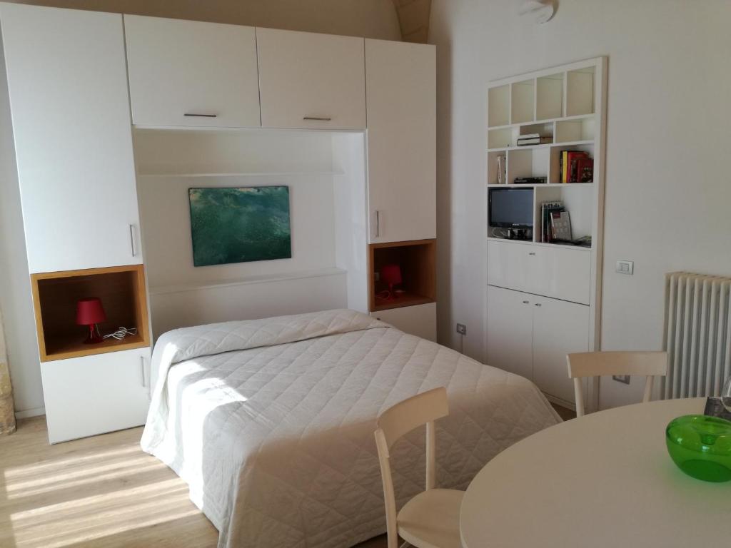 Posteľ alebo postele v izbe v ubytovaní GoodStay Al 14 (monolocale)