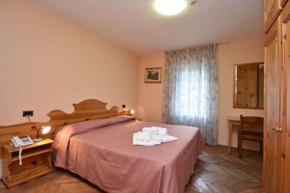 Postel nebo postele na pokoji v ubytování Hotel Villa Agomer