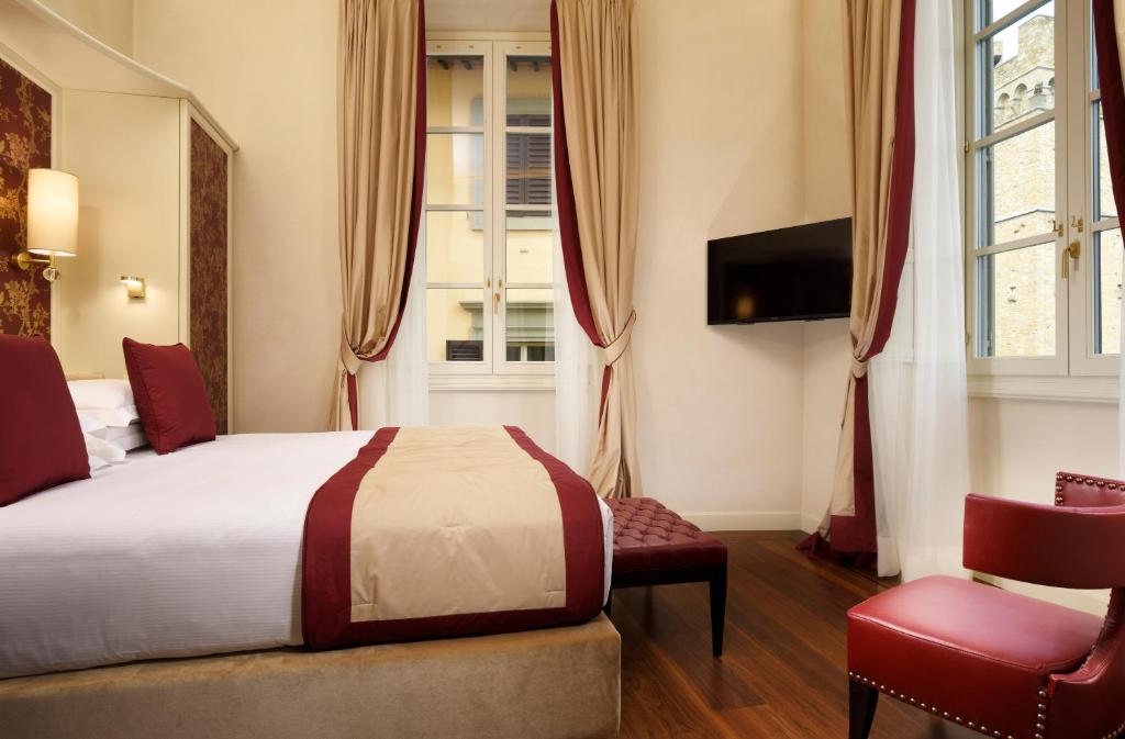 Televízia a/alebo spoločenská miestnosť v ubytovaní San Firenze Suites & Spa
