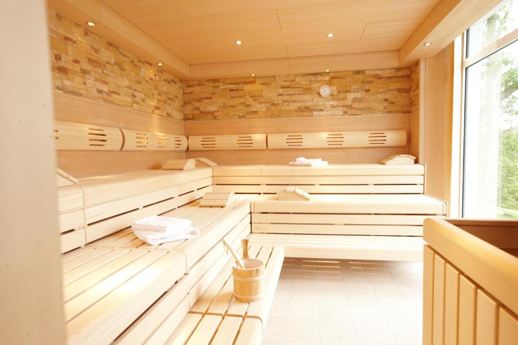 Ein Bett oder Betten in einem Zimmer der Unterkunft Seehotel Fleesensee
