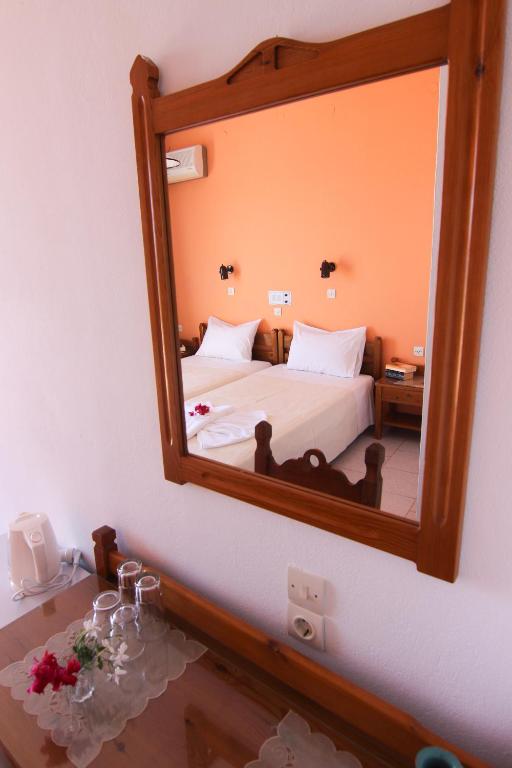 Postel nebo postele na pokoji v ubytování Lofos Hotel