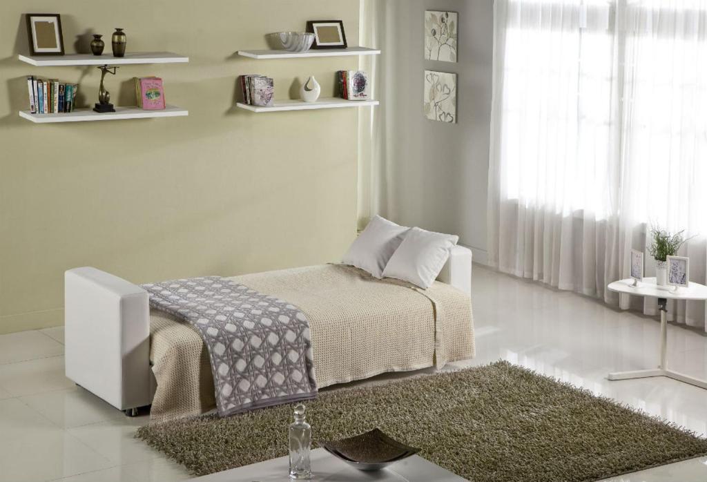 a white bedroom with a bed and a rug at Anna Maria - Vanessa Apartments in Neo Klima