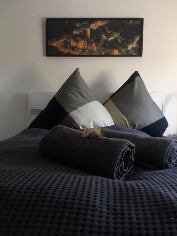 a bedroom with a bed with pillows on it at Pension Schackstedt in Schackstedt