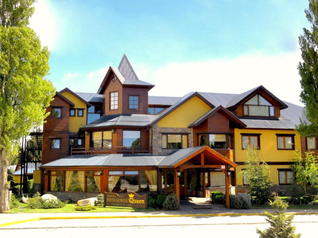 a large house with a large building at Patagonia Queen Hotel Boutique in El Calafate