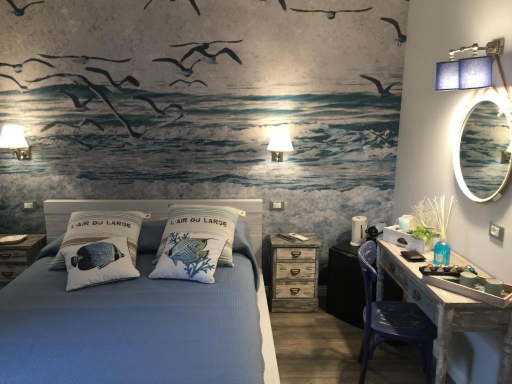 Postel nebo postele na pokoji v ubytování Echi del Mare