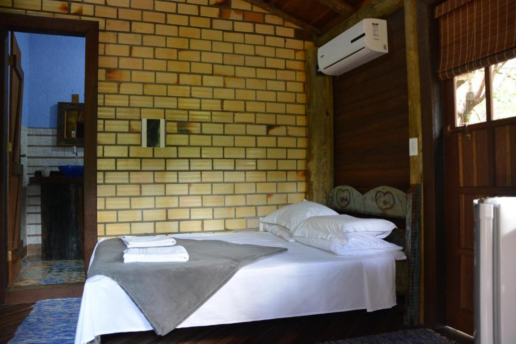 Cama ou camas em um quarto em Pousada Favo De Mel