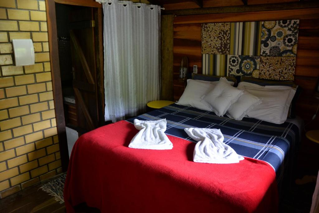 Cama ou camas em um quarto em Pousada Favo De Mel