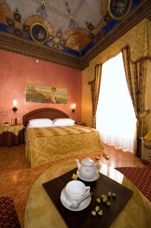 Postel nebo postele na pokoji v ubytování Hotel Joli