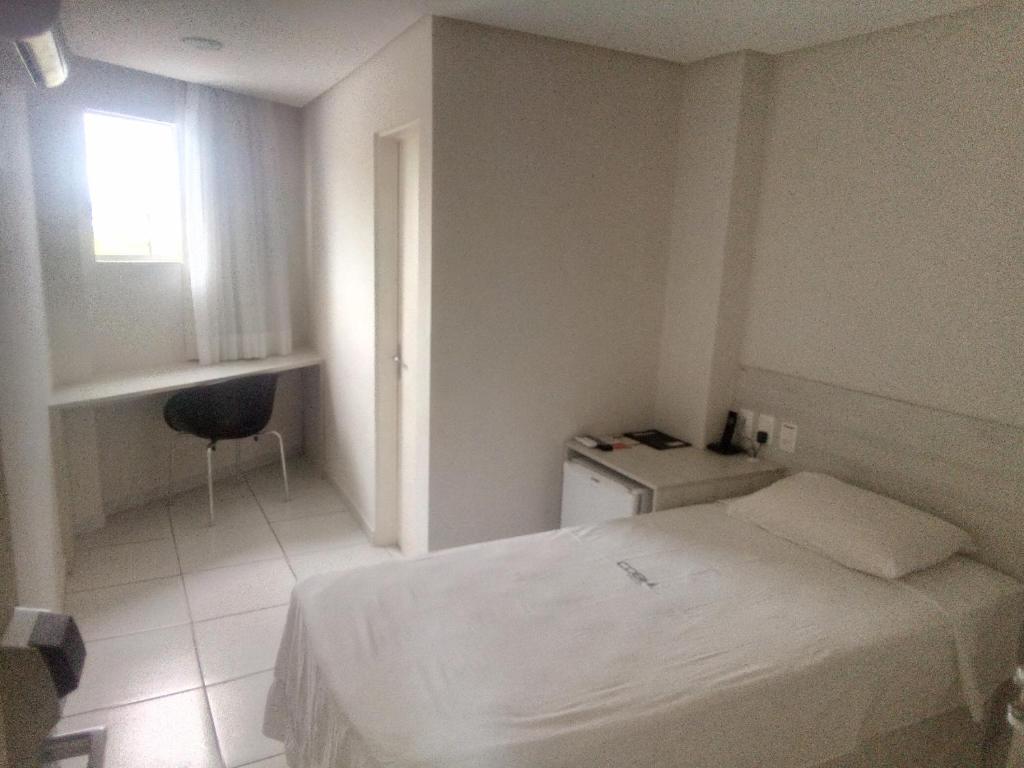Postel nebo postele na pokoji v ubytování COBH Hotel