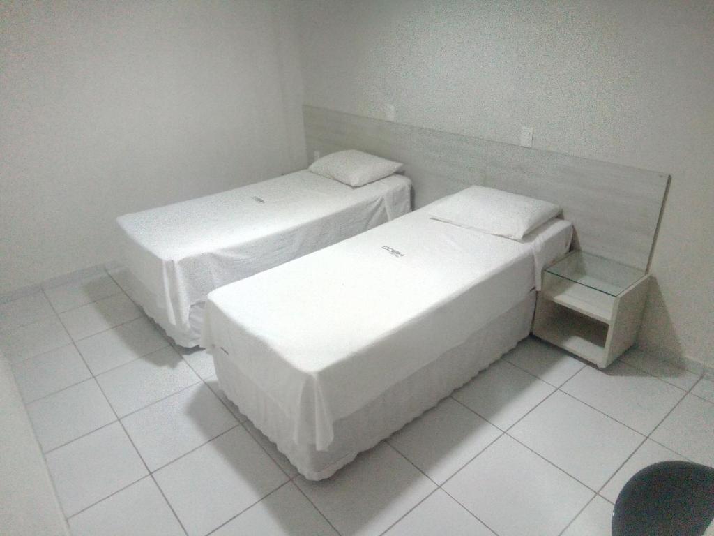 Postel nebo postele na pokoji v ubytování COBH Hotel